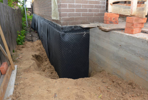 Happy homeowners after waterproofing job in Pike Road